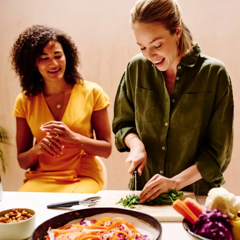 Third Sister's founder and registered dietitian Clementine Vaughan demonstrating nutritious food prep to women